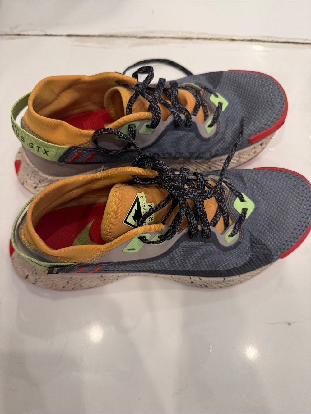 Nike Grey and Yellow Trail Sneakers with Red Accents